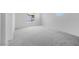 Bright bedroom with large window and neutral carpet at 14628 W Sand Hills Rd, Surprise, AZ 85387