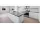 Modern kitchen with granite counters, stainless appliances, and a convenient center island at 14628 W Sand Hills Rd, Surprise, AZ 85387