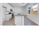 Modern kitchen featuring an island, stainless steel appliances and natural light at 14628 W Sand Hills Rd, Surprise, AZ 85387