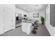 Modern kitchen with granite counters, stainless steel appliances, and an island with bar stool seating at 14628 W Sand Hills Rd, Surprise, AZ 85387