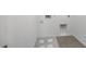Laundry room with tile flooring, utility connections, and white walls, ready for appliances at 14628 W Sand Hills Rd, Surprise, AZ 85387
