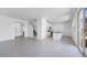 Open-concept living space with staircase, kitchen, and sliding door at 14628 W Sand Hills Rd, Surprise, AZ 85387