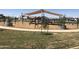 Community playground featuring modern play structures and a soft ground surface, providing a safe space for children to play at 14628 W Sand Hills Rd, Surprise, AZ 85387