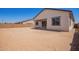 View of the backyard, with a covered patio and ample space for outdoor living at 15822 W Bronco Trl, Surprise, AZ 85387