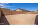 Spacious backyard enclosed by a brick wall, providing privacy and ample space for outdoor activities at 15822 W Bronco Trl, Surprise, AZ 85387