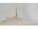 An open, sunlit bedroom featuring light tile floors, white trim, and modern lighting at 15822 W Bronco Trl, Surprise, AZ 85387