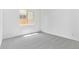 Cozy bedroom with carpet flooring and a large window at 15822 W Bronco Trl, Surprise, AZ 85387