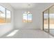 Bright dining room with natural light and access to backyard through sliding doors at 15822 W Bronco Trl, Surprise, AZ 85387