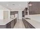 Spacious kitchen with a central island, stainless steel appliances, and plenty of counter space at 15822 W Bronco Trl, Surprise, AZ 85387
