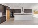 Well-appointed kitchen with stainless steel appliances and a large center island at 15822 W Bronco Trl, Surprise, AZ 85387