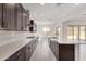 Bright, spacious kitchen with stainless steel appliances and a central island at 15822 W Bronco Trl, Surprise, AZ 85387