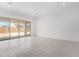 Bright living room features sliding glass doors leading to the backyard at 15822 W Bronco Trl, Surprise, AZ 85387