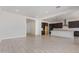 Open-concept living space with abundant natural light and tile flooring at 15822 W Bronco Trl, Surprise, AZ 85387