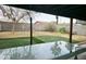 Expansive backyard featuring artificial turf, block fencing, and a basketball hoop at 17648 N 36Th St, Phoenix, AZ 85032
