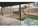 A backyard featuring a covered bar area, artificial turf, and patio at 17648 N 36Th St, Phoenix, AZ 85032