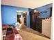 A blue bedroom featuring mirrored closet doors, two dressers, carpeted floors, and a bed at 17648 N 36Th St, Phoenix, AZ 85032