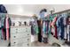 Walk-in closet features built in shelving, drawers and ample space for storage at 18069 W Tina Ln, Surprise, AZ 85387