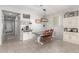 Bright dining area featuring tile flooring, a modern light fixture, and an open layout perfect for gatherings and Gathering meals at 18069 W Tina Ln, Surprise, AZ 85387