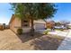 Charming single-story home featuring a neutral color scheme, well-maintained landscaping, and a spacious two-car garage at 18069 W Tina Ln, Surprise, AZ 85387