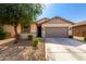 Charming single-story home featuring a neutral color scheme, well-maintained landscaping, and a spacious two-car garage at 18069 W Tina Ln, Surprise, AZ 85387