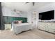 Bright main bedroom with a ceiling fan, natural light and stylish decor at 18069 W Tina Ln, Surprise, AZ 85387