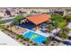 Aerial view of community playground with colorful splash pad and surrounding greenery at 18069 W Tina Ln, Surprise, AZ 85387