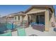 Spacious backyard featuring a sparkling pool, covered patio, and secure fencing at 18187 W Via Montoya Dr, Surprise, AZ 85387