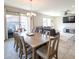 Open dining room with large table perfect for entertaining, with easy access to the living room and patio at 18187 W Via Montoya Dr, Surprise, AZ 85387