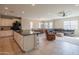 Open kitchen with a central island, seamlessly connected to the dining and living areas at 18187 W Via Montoya Dr, Surprise, AZ 85387