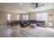Spacious living room with tile floors, neutral color palette, and comfortable seating at 18187 W Via Montoya Dr, Surprise, AZ 85387