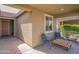 Covered front porch featuring outdoor seating. Two chairs with a table at 18187 W Via Montoya Dr, Surprise, AZ 85387