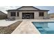 Back patio with view of backyard and pool area at 18542 W Luke Ave, Litchfield Park, AZ 85340