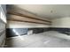 Spacious garage interior with shelving for ample storage at 18542 W Luke Ave, Litchfield Park, AZ 85340