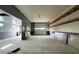 Spacious garage with two-tone paint, concrete floors, and room for parking and hobbies at 18542 W Luke Ave, Litchfield Park, AZ 85340