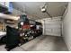 Well-organized garage with shelving units, storage containers, and ample space for parking at 18542 W Luke Ave, Litchfield Park, AZ 85340