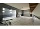 Spacious garage with two-tone paint, concrete floors, and an automatic garage door at 18542 W Luke Ave, Litchfield Park, AZ 85340