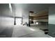 Spacious garage with two-tone paint, concrete floors, and ample room for storage at 18542 W Luke Ave, Litchfield Park, AZ 85340
