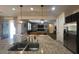 Open kitchen view showcases granite counters, stainless steel appliances, and sightlines to the living area at 18542 W Luke Ave, Litchfield Park, AZ 85340