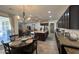 Large kitchen features a central island, stainless appliances, pendant lighting and easy access to other living spaces at 18542 W Luke Ave, Litchfield Park, AZ 85340