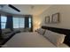 Comfortable main bedroom featuring plush bedding and natural light, and modern furnishings at 18542 W Luke Ave, Litchfield Park, AZ 85340