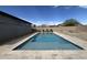 Inviting pool with lounge chairs and umbrellas for relaxing on sunny days at 18542 W Luke Ave, Litchfield Park, AZ 85340