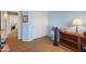 Bedroom featuring wood-look floors, a large closet, and blue-painted walls at 18886 N 77Th Ave, Glendale, AZ 85308