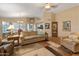 Spacious living area with a high ceiling, comfortable seating, and easy access to the kitchen and dining spaces at 18886 N 77Th Ave, Glendale, AZ 85308