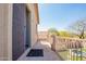 Private balcony offers views of the lush backyard with pool, foliage, and blue sky at 22236 N 48Th St, Phoenix, AZ 85054