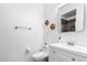 Clean bathroom featuring white vanity, modern fixtures, and decorative wall art at 22236 N 48Th St, Phoenix, AZ 85054