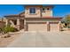 Two-story home featuring a three-car garage, low maintenance yard, and classic desert landscaping at 22236 N 48Th St, Phoenix, AZ 85054
