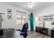 Bright home office with large window, ceiling fan, surfboard and unique decor at 22236 N 48Th St, Phoenix, AZ 85054