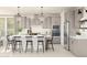 Spacious kitchen with stainless steel appliances, modern cabinetry, and a center island with seating at 2370 W Los Arboles Pl, Chandler, AZ 85224