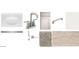 Selection of design studio materials including a sink, brushed nickel faucet, cabinet door, and flooring at 24091 W Bowker St, Buckeye, AZ 85326
