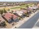 A neighborhood featuring single Gathering homes with well manicured desert landscaping and golf course views at 2453 E Hancock Trl, Casa Grande, AZ 85194